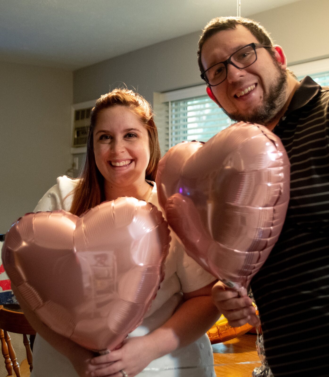 Kayla and Dustin with heart balloons