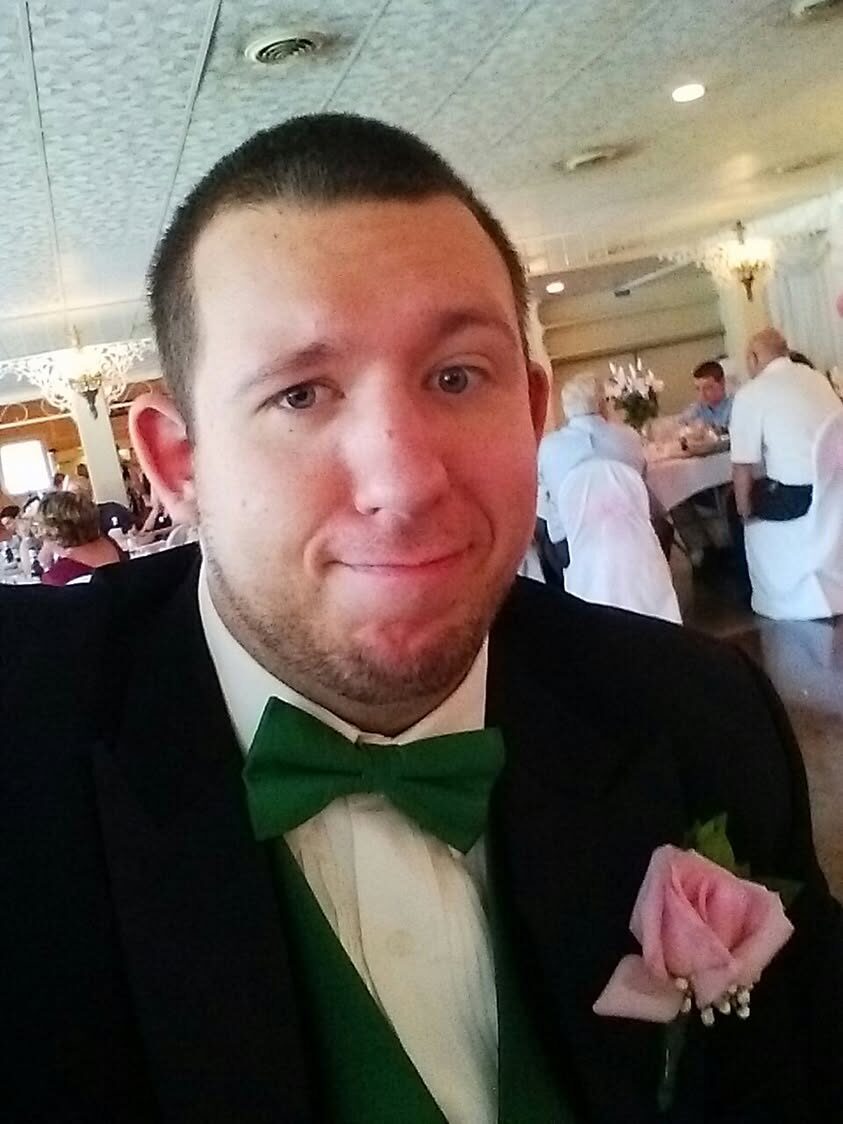 Dustin in a suit and bow tie